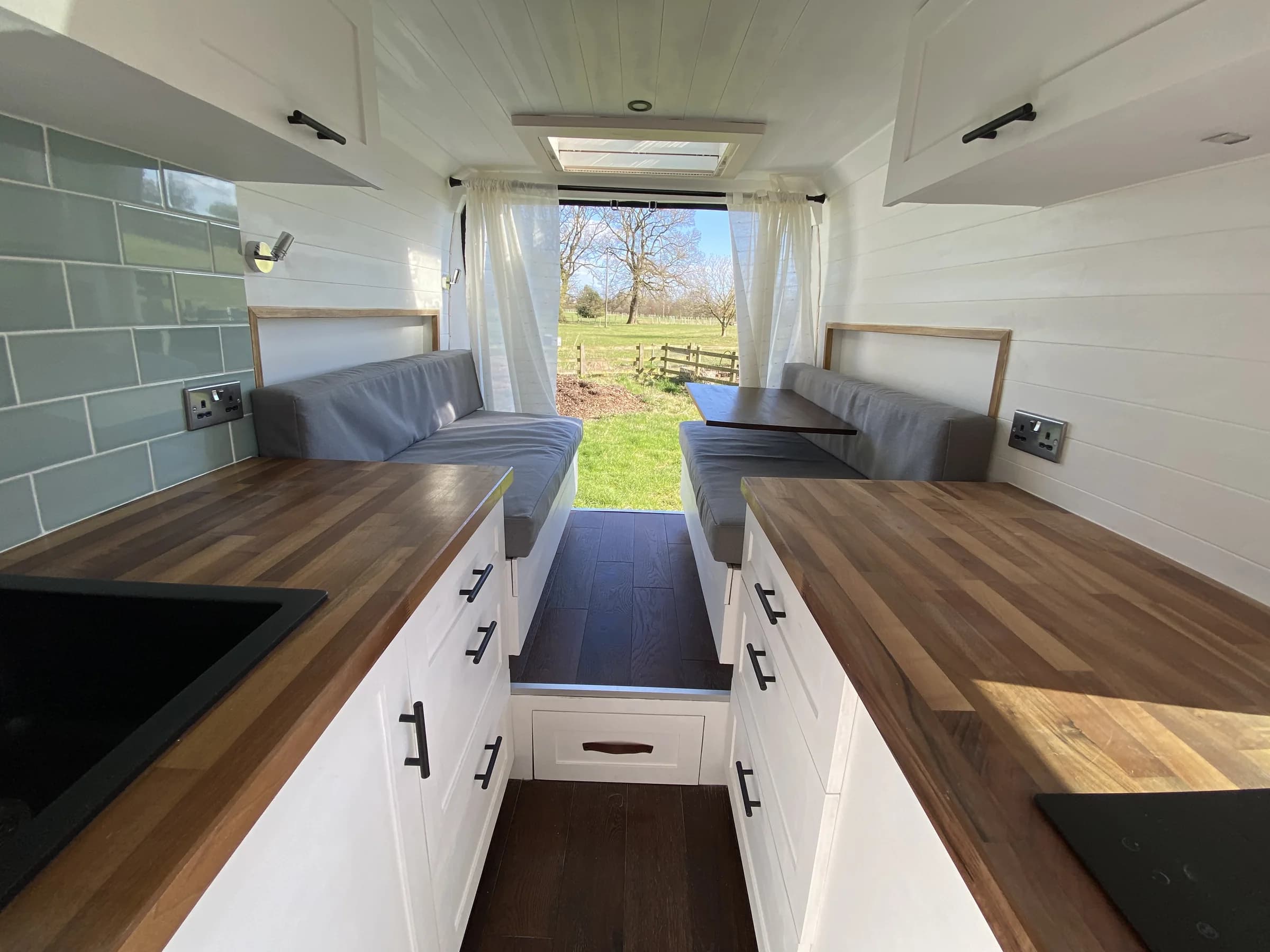 Roam Wired's own finished Fiat Ducato interior with galley, seating and storage