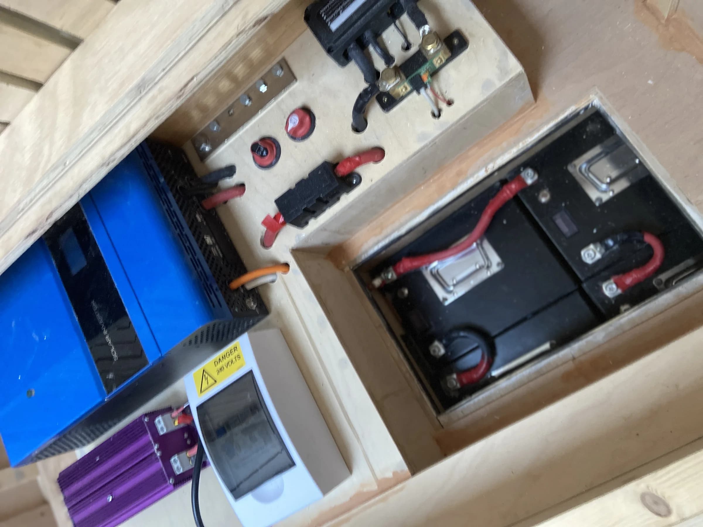 Battery bay in Jack's Fiat Ducato conversion: lithium batteries, inverter, bus bar, battery shunt and a 240V consumer unit