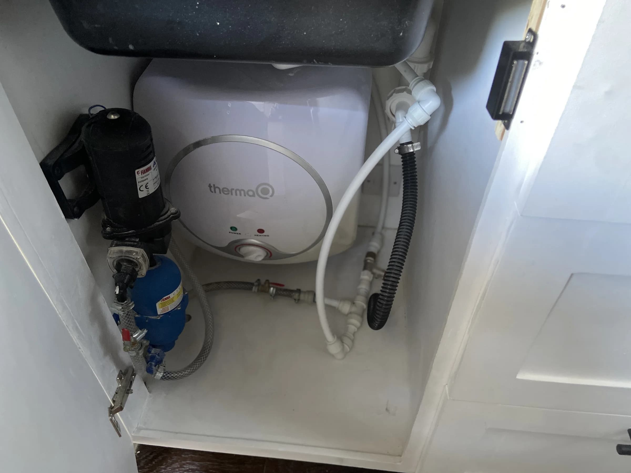 Accessible campervan water heater, pump, strainer and pipework installation
