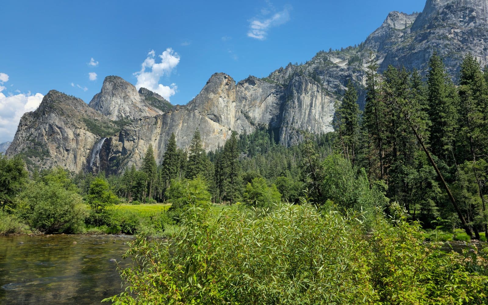 Granite cliffs and greenery in Yosemite Valley, California