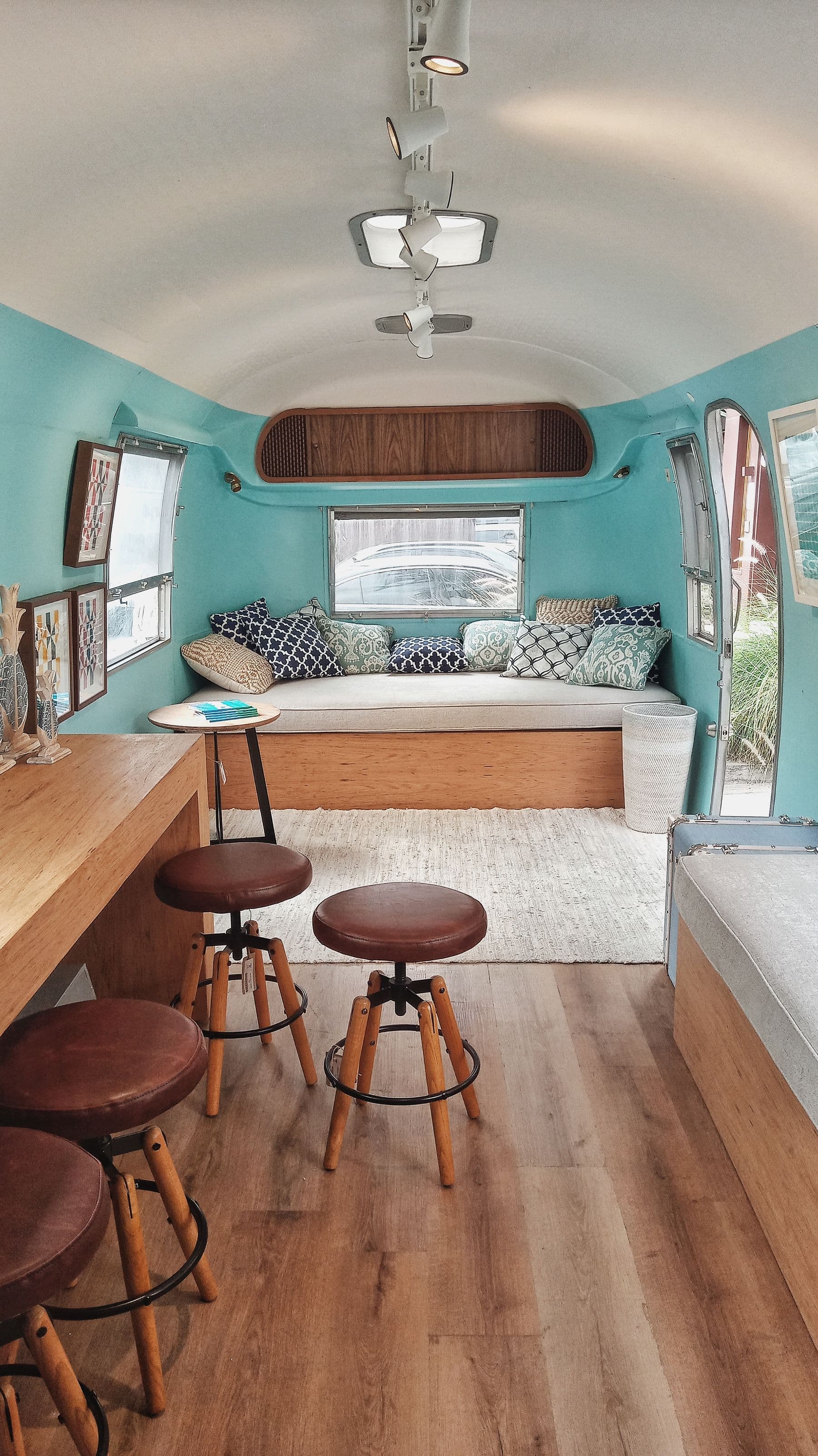 Finished camper interior with seating and compact furniture