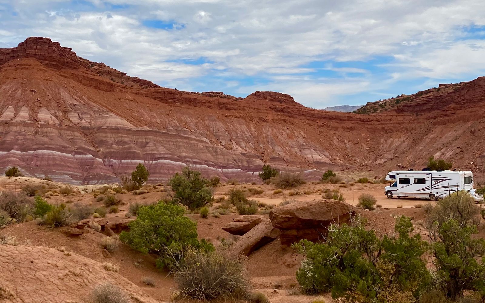 Camper van parked among red-rock desert formations — Flagstaff