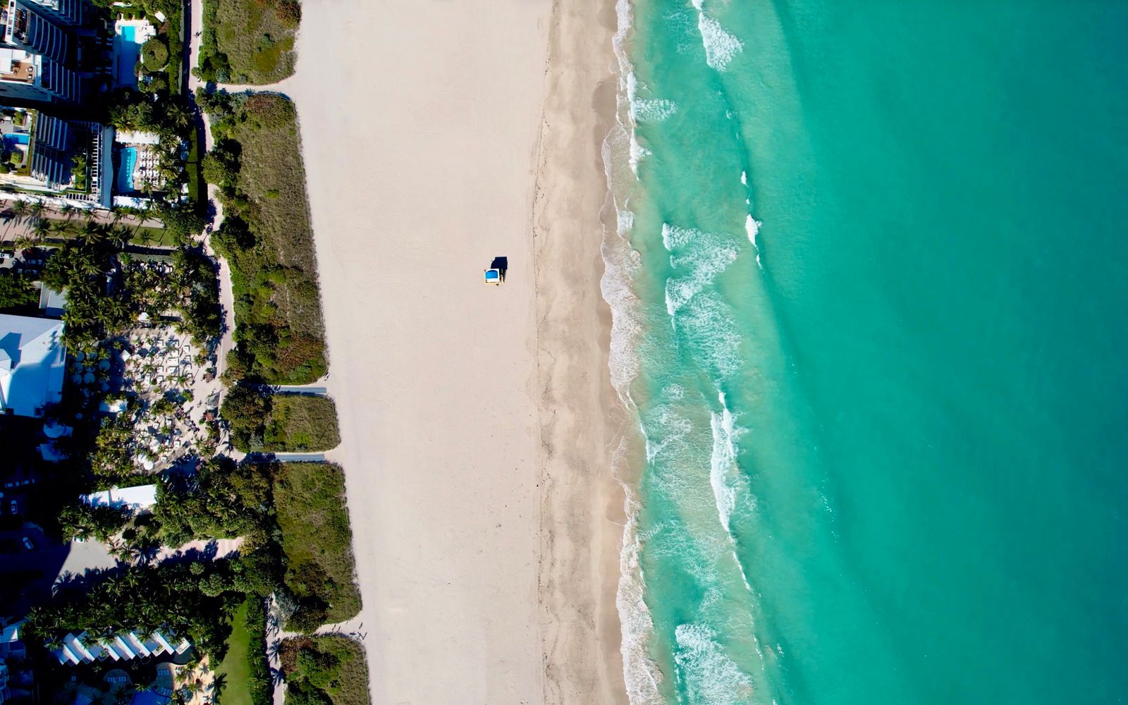 The turquoise coastline of Miami Beach from above