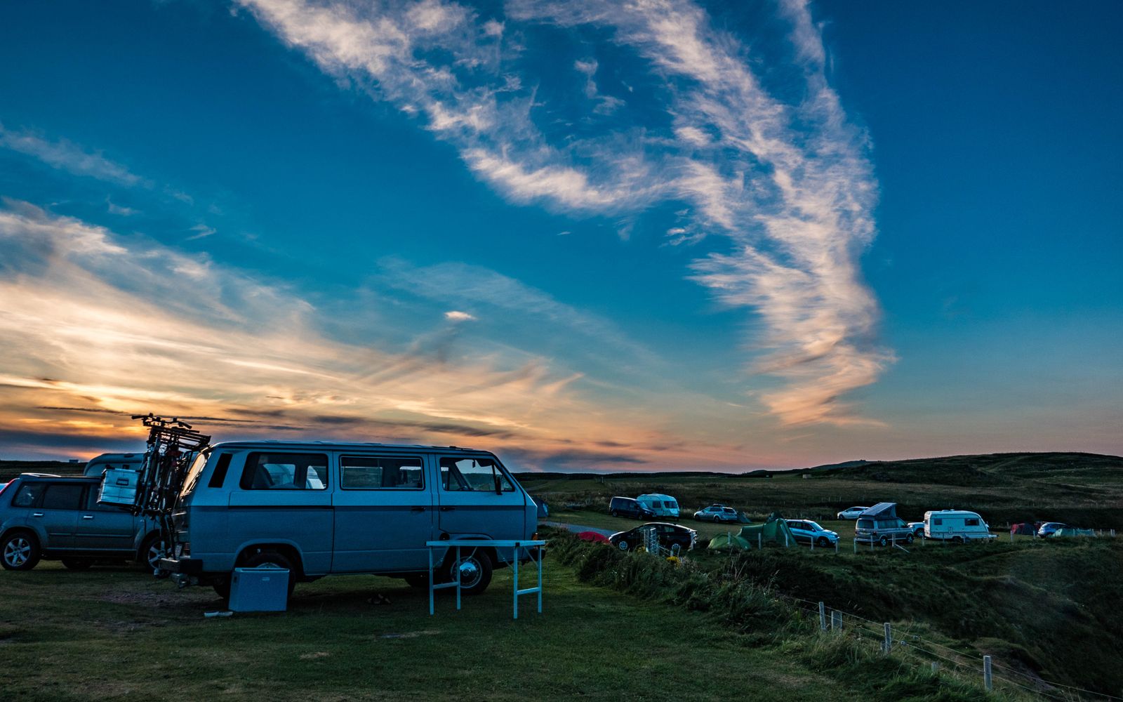 Volkswagen campervans parked at sunset in the Scottish Highlands — Stirling